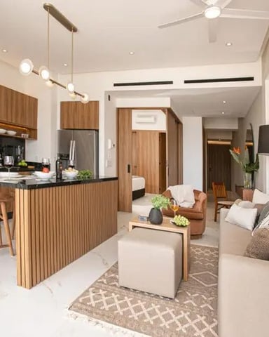 White kitchen and dining nook with round table and tall windows